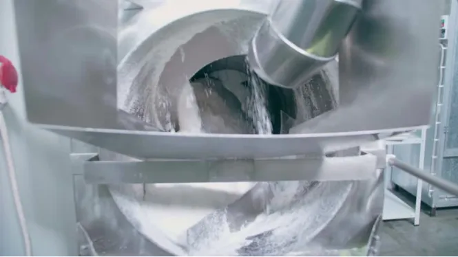 industrial powder mixer blending fine materials inside stainless steel chamber